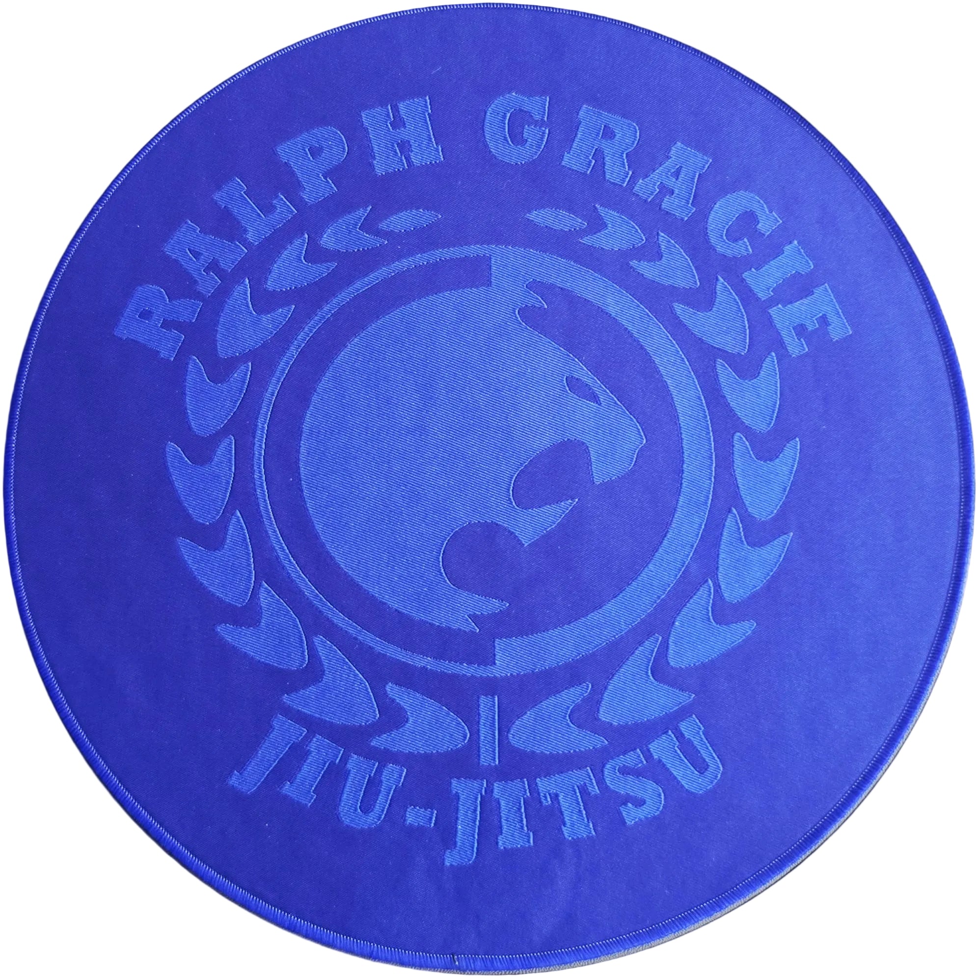 Blue circular mat with 'Ralph Gracie Jiu-Jitsu' branding on a white background